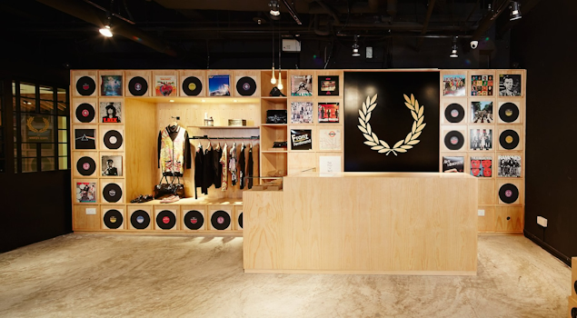 The Fred Perry Laurel Wreath Store in Singapore, designed by Studio Königshausen, pays homage to music and youth culture through its unique design. 